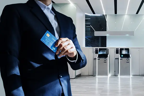 Businessman holding credit card