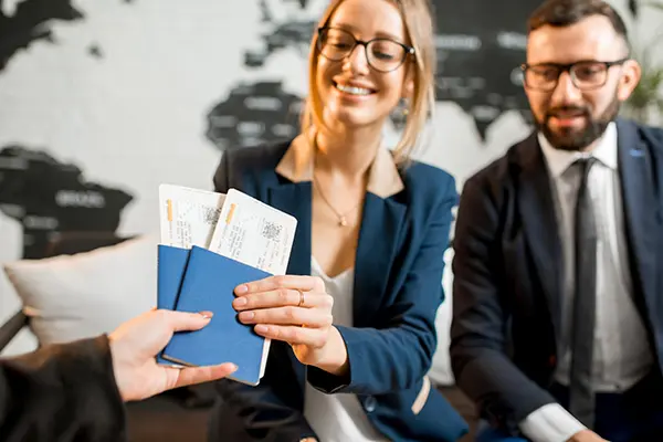 Couple receiving tickets and passports