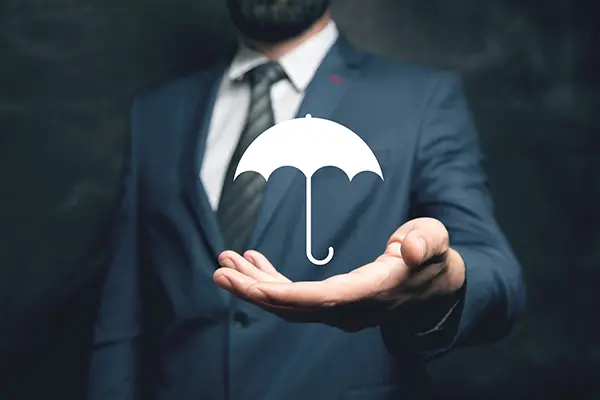 Man holding umbrella icon in his hand